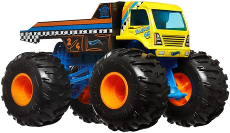 Yellow and black monster truck toy with oversized wheels and blue suspension details on white background