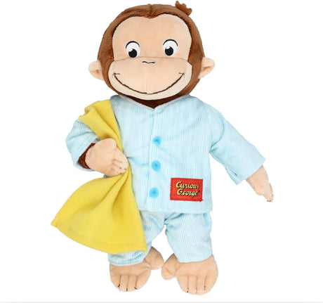 Curious George | Pajamas plush toy wearing blue pajamas and holding a yellow blanket, perfect for kids ages 2 and up.