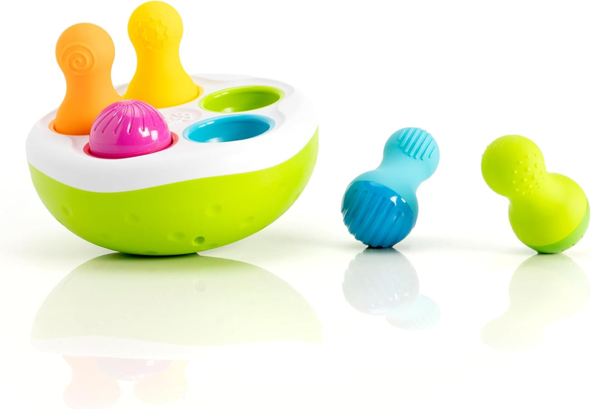 SpinnyPins with five colorful textured pins and a wobbling green bowl for sensory play and motor skill development.