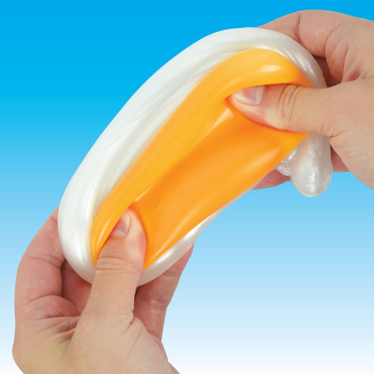 Hands stretching and squishing orange and white Egg-cellent Thinking Putty for sensory play and fun.