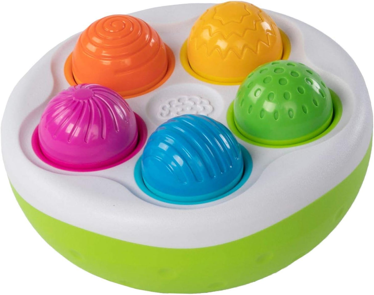 SpinnyPins colorful textured wobble pins fit into a tilted bowl for sensory play and motor skills development.