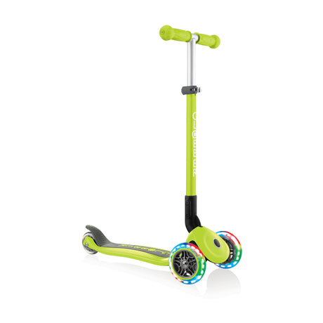 Scooter Primo Light Up Foldable | Green three-wheel kids scooter with LED light-up wheels and adjustable T-bar for ages 3-7+.