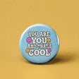 Button | You are You and That's Cool with smiley faces on light blue background, expressing positivity and self-acceptance.