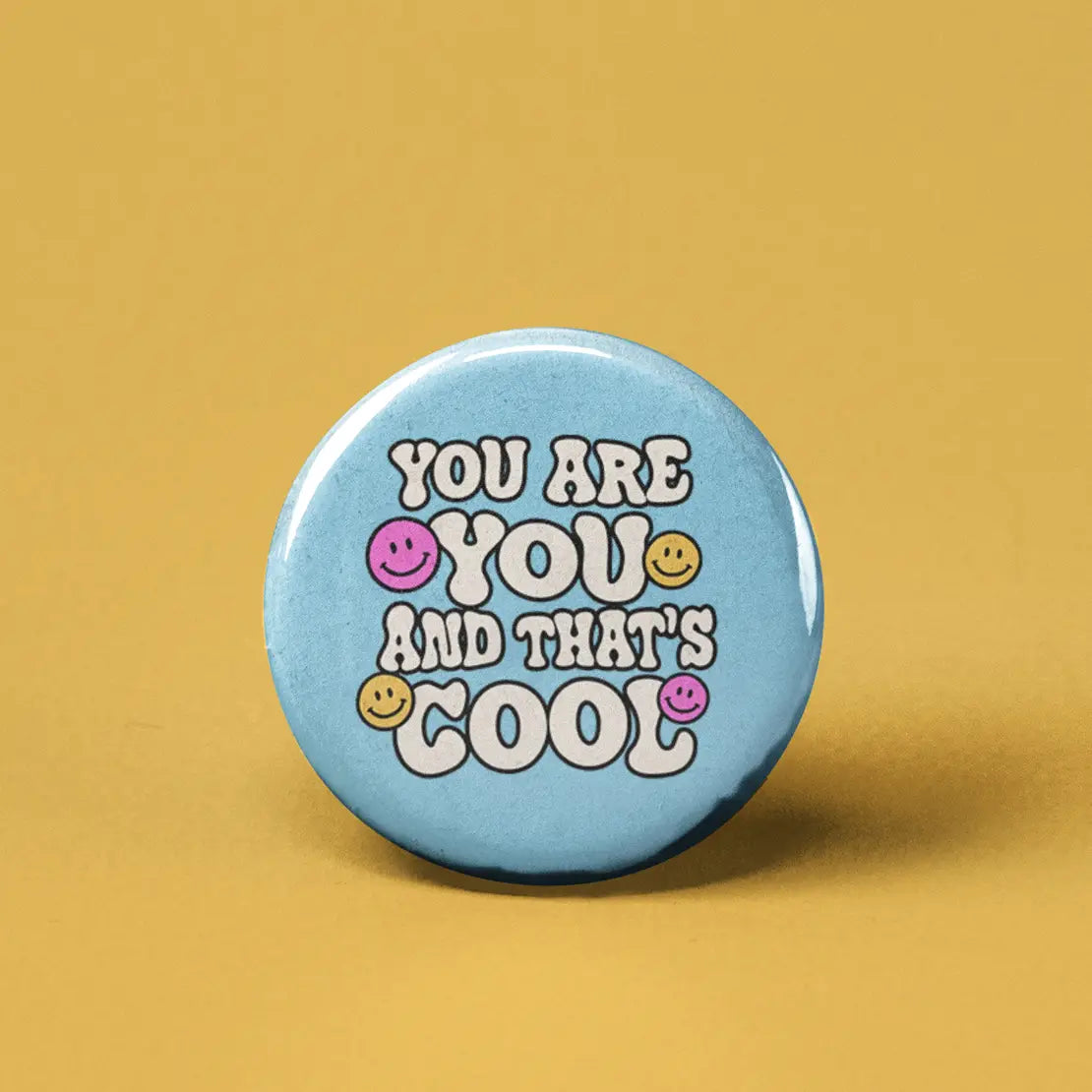 Button | You are You and That's Cool with smiley faces on light blue background, expressing positivity and self-acceptance.