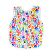 Bapron | Rainbow Watercolor 6M-3T toddler bib-apron with vibrant floral pattern, waterproof and baby-safe fabric.