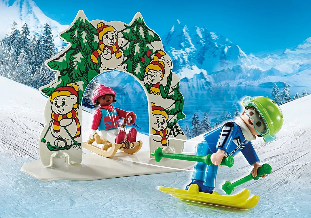 My Life | Ski World with figures skiing and sledding through snowy mountain arch with bear illustrations.
