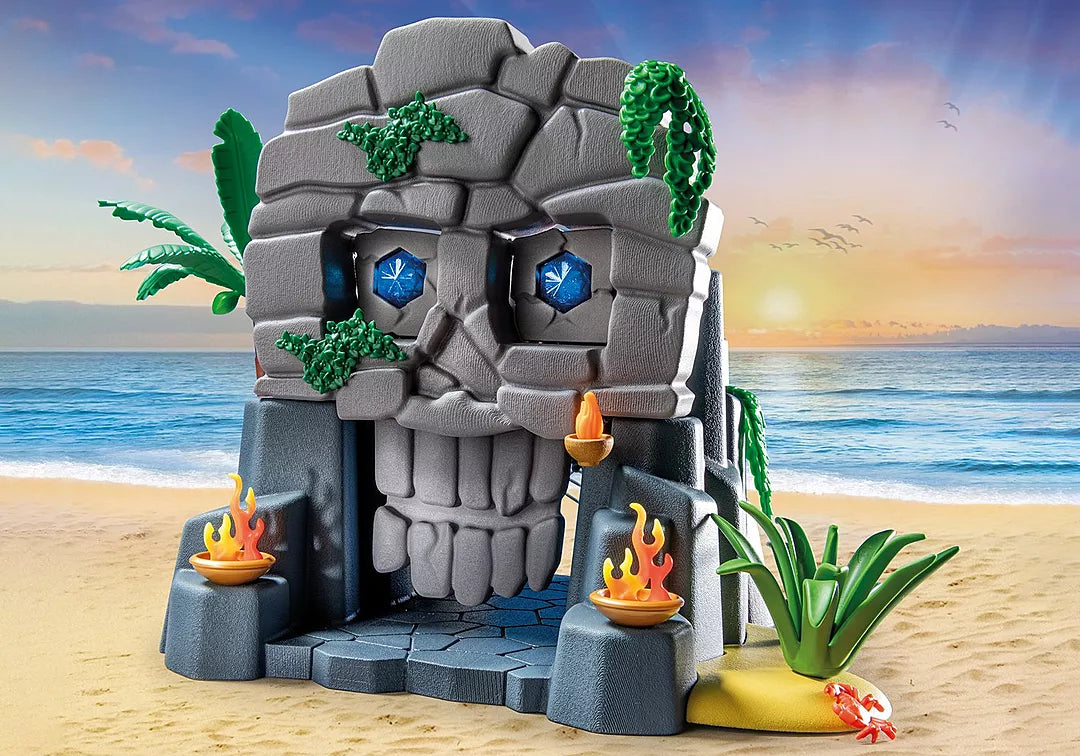 Pirates | Skull Island playset featuring a skull-shaped island with crystal eyes, torches, and tropical plants on the beach.