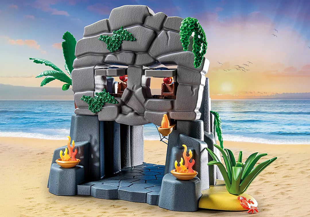 Pirates | Skull Island playset with skull-shaped island entrance, flames, plants, and ocean background for pirate adventures.