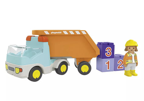 Junior Dump Truck toy with detachable orange dump bed, numbered stackable stones, and construction worker figure.