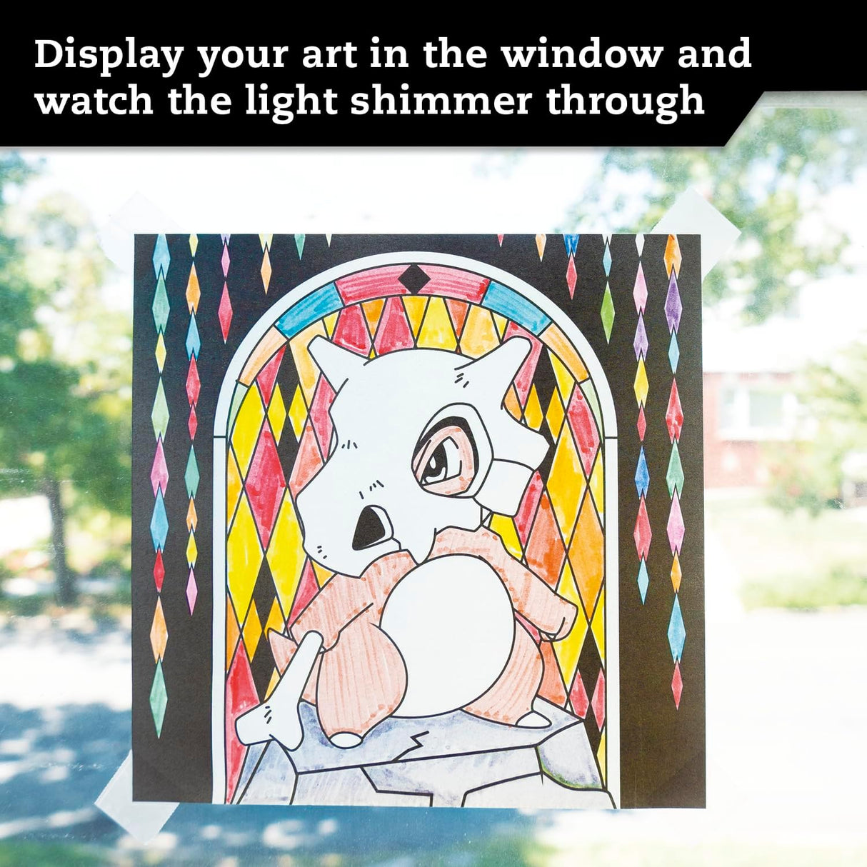 Pokemon Stained Glass Art showing colored Cubone artwork on window with bright stained glass effect in sunlight.