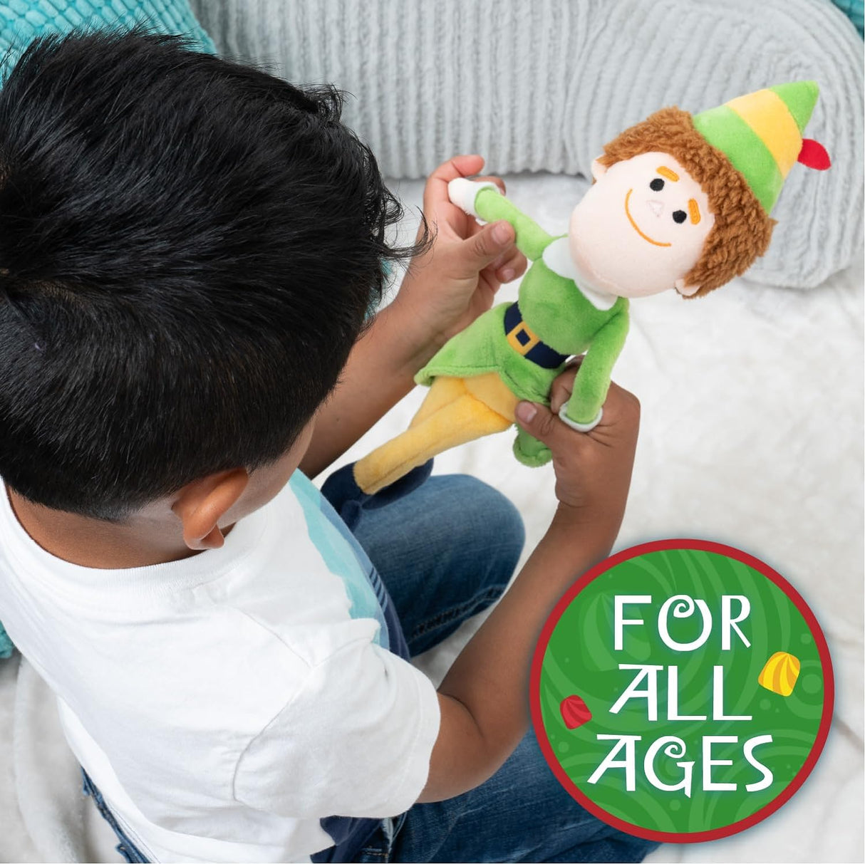 Child holding the 21" Buddy the Elf Plush, a safe and charming toy for all ages, perfect for holiday cuddles.