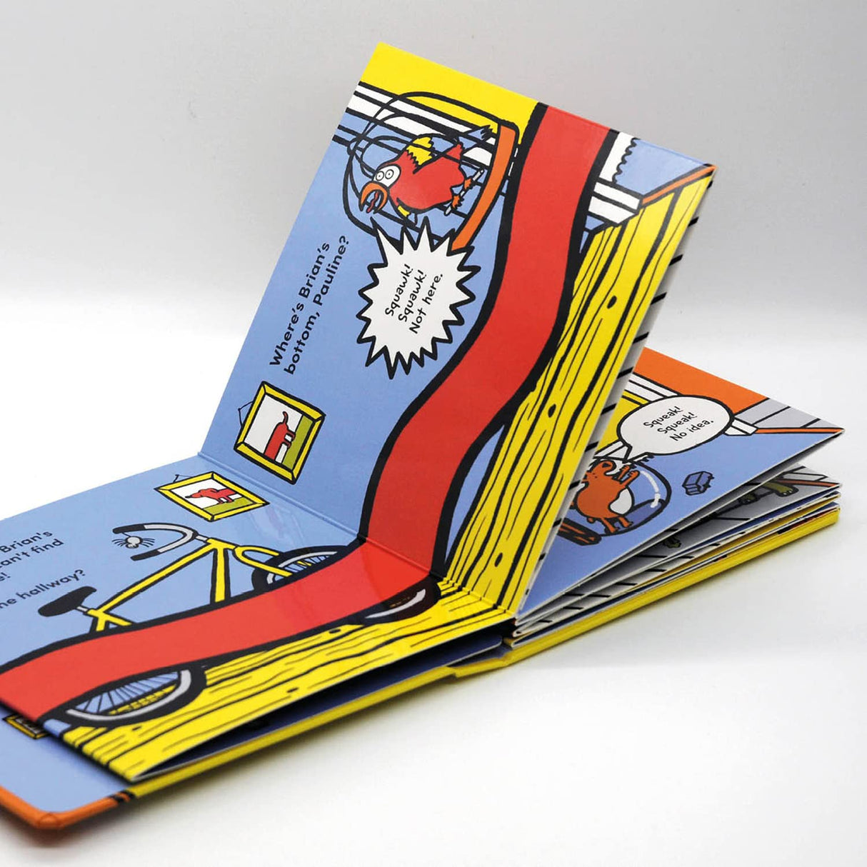 Open concertina board book "Where's Brian's Bottom?" featuring long red dog and colorful house scenes for children.