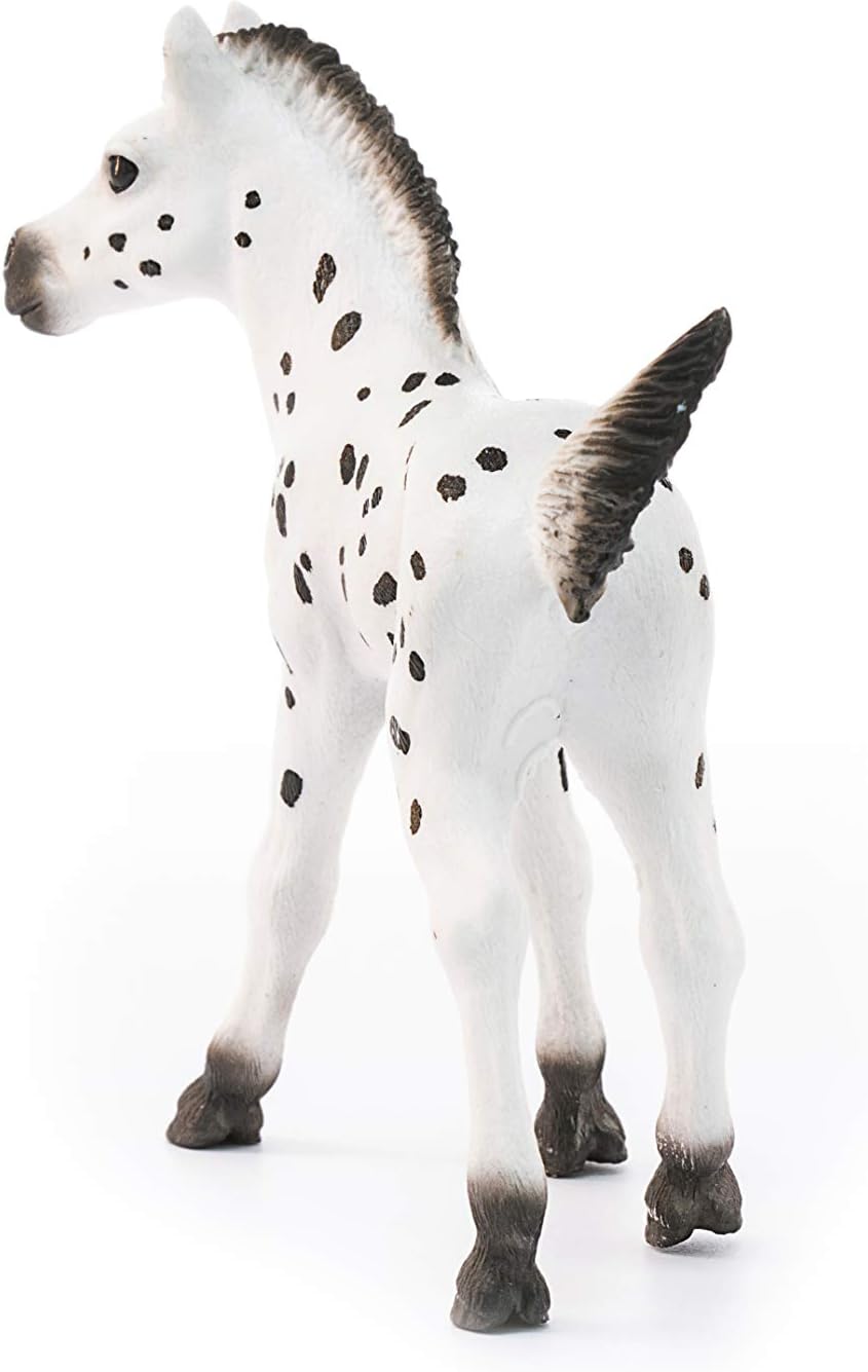Knapstrupper Foal Horse toy with detailed white coat and black spots, designed to educate and inspire children.