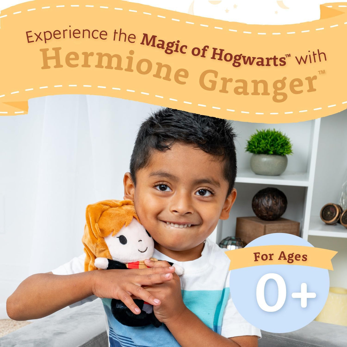 Child happily holding Harry Potter | Hermione plush toy, a soft, collectible stuffed animal for ages 0 and up.