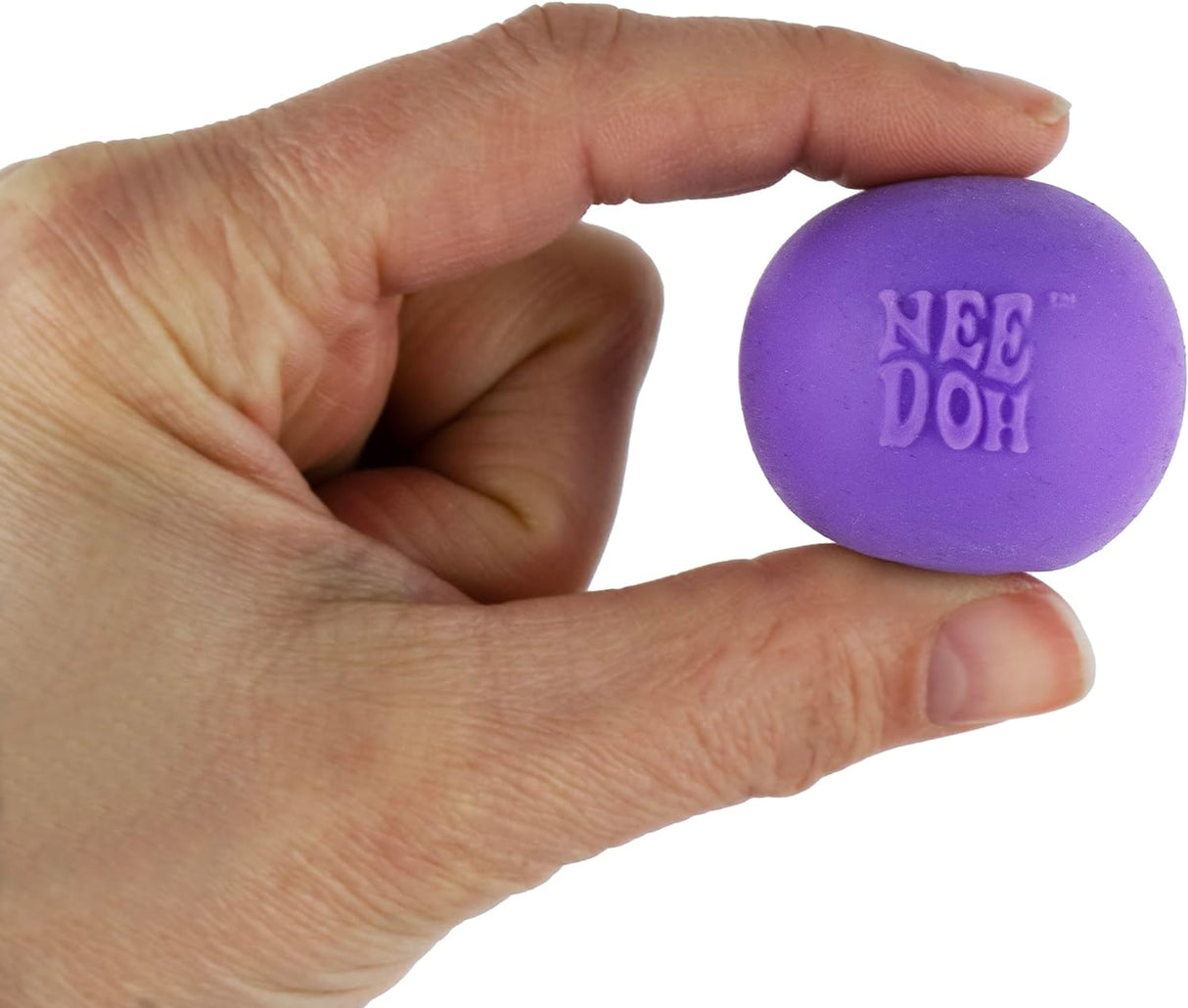 Hand holding a purple World's Smallest NeeDoh stress ball, perfect pocket-sized fidget toy for all ages.