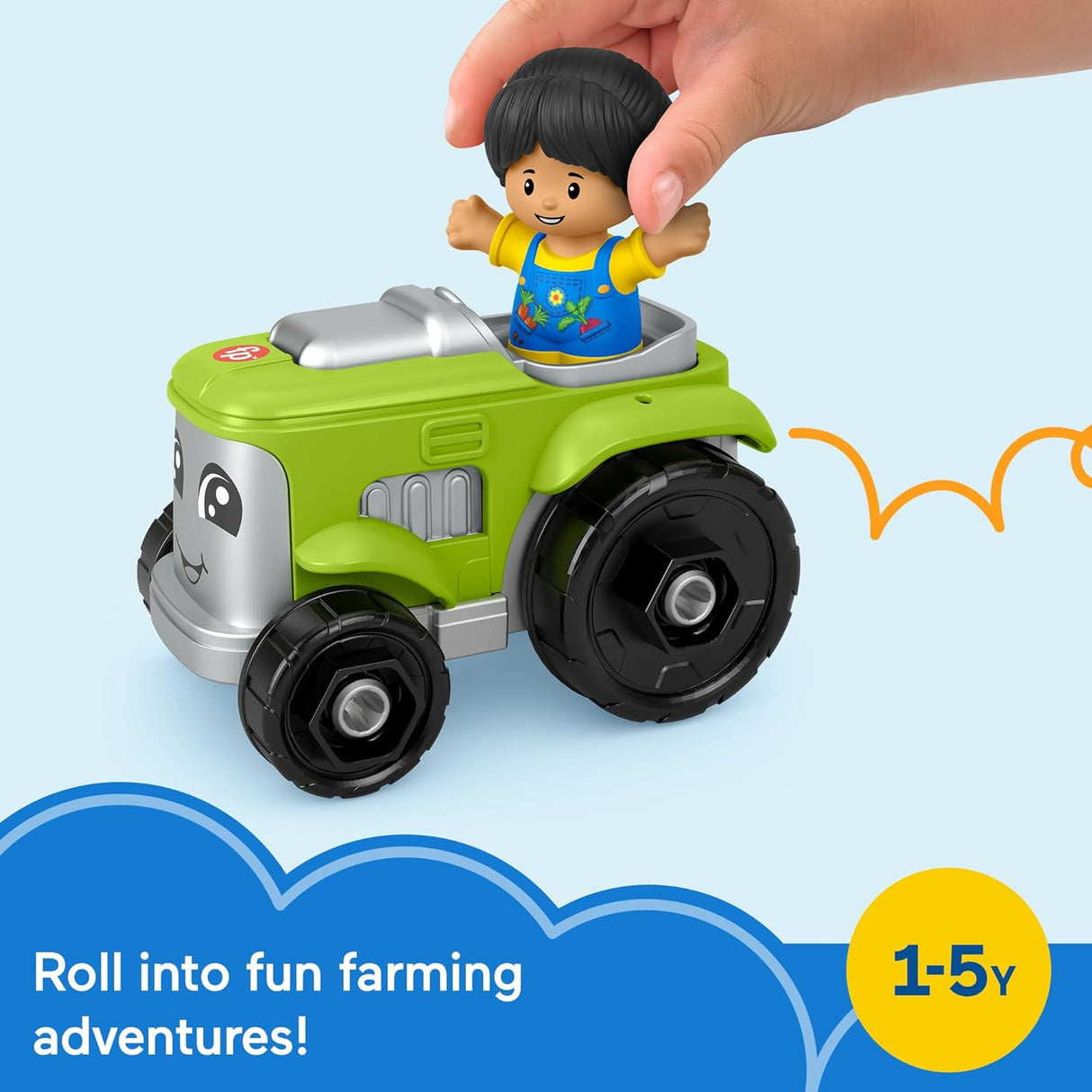 Hand placing a smiling figure on a green Little People Tractor toy for toddlers to roll and play.