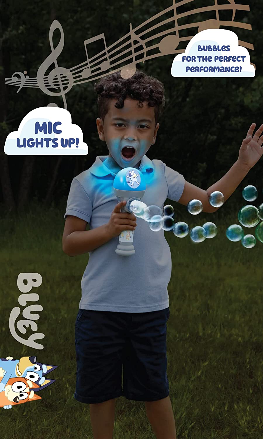 Child playing outdoors with Bluey Dance Bubble & Sing Mic lighting up and blowing bubbles in the evening.