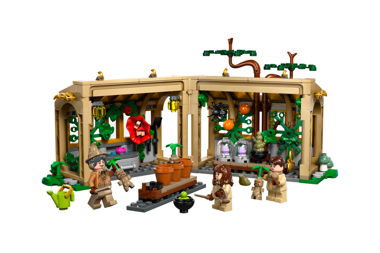 Harry Potter Hogwarts Castle Herbology Class LEGO set with greenhouse, magical plants, and minifigures in wizard classroom playset.