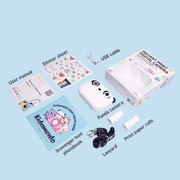 Print & Digital Camera Model P | Koko the Panda with panda camera, print rolls, USB cable, sticker sheet, and photo book accessories.