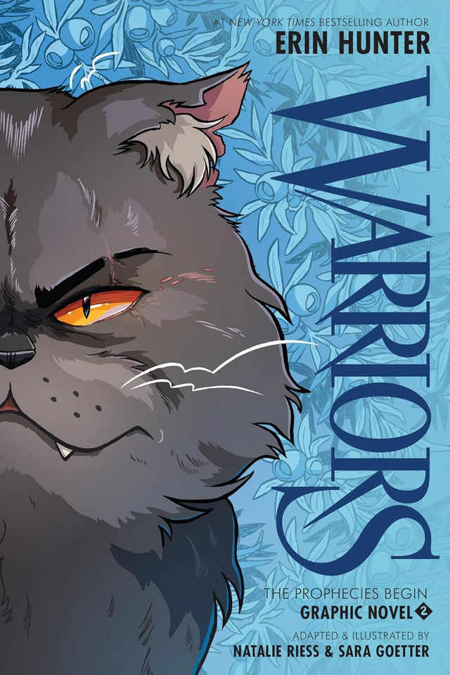 Cover of Warriors #2: The Prophecies Begin graphic novel featuring a fierce cat with glowing amber eyes on a blue floral background.