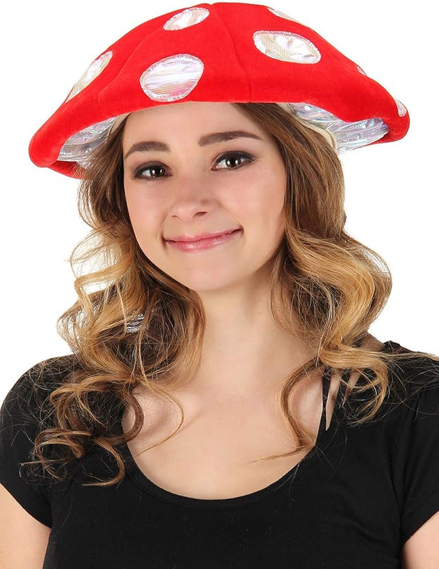 Young woman wearing a red and white Mushroom Lumen Hat with glowing LED lights and adjustable size.