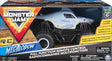 RC Monster Jam Megalodon 1:24 scale remote control truck with oversized tires and realistic shark design in packaging.