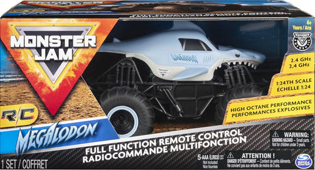 RC Monster Jam Megalodon 1:24 scale remote control truck with oversized tires and realistic shark design in packaging.