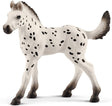 Knapstrupper Foal Horse lifelike toy with detailed black spots, perfect for teaching toddlers about animals.