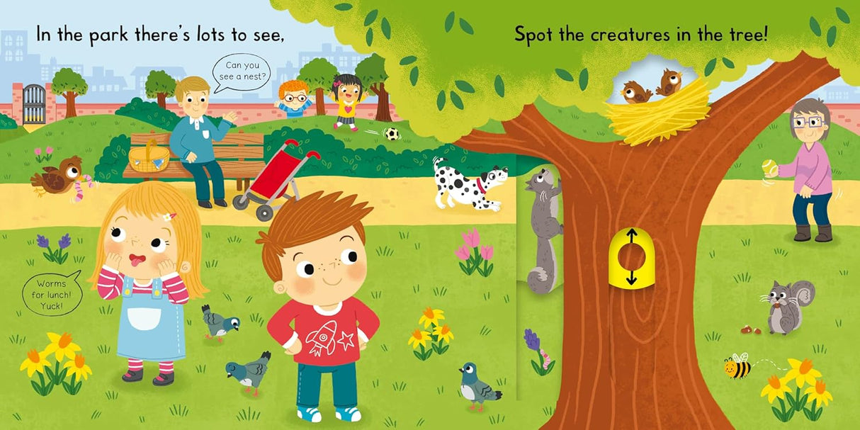 Bright and colorful Busy Park Push/Pull/Slide board book scene with children, animals, and interactive playground elements.