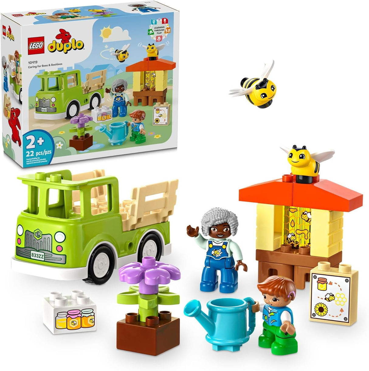 Children's toy set with beehive, truck, flowers, bees, and two figures for imaginative play and learning.