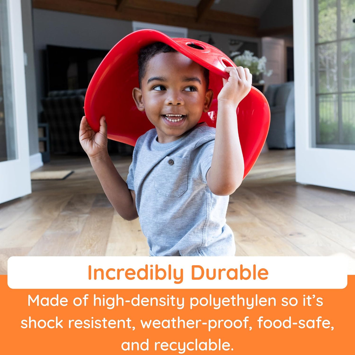 Child playing indoors with a bright red Bilibo wearable toy promoting imaginative play and durability.