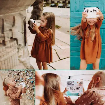 Child using the Print & Digital Camera Model P | Koko the Panda to take instant black-and-white photos and selfies.