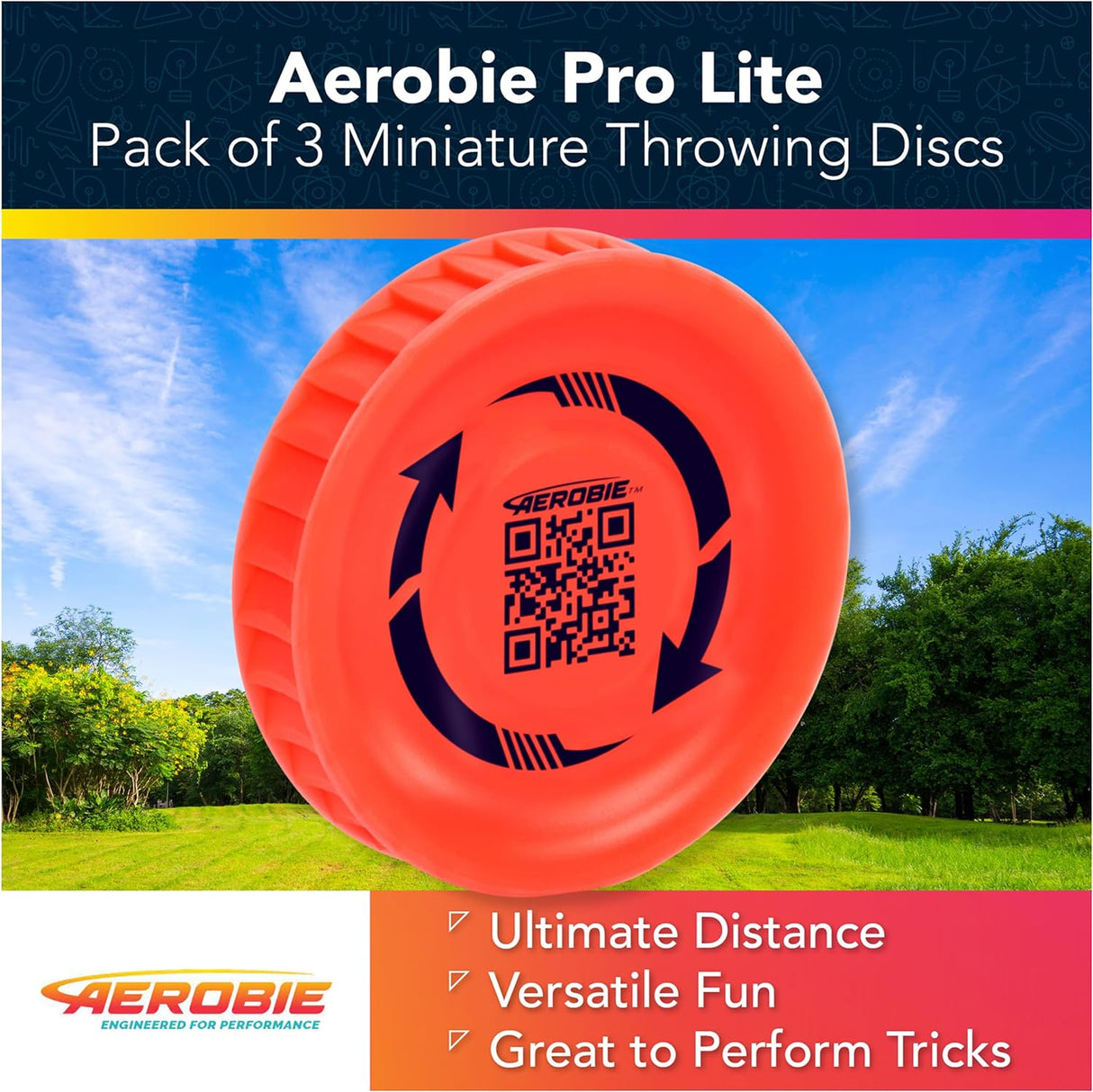 Aerobie Pro Lite red miniature throwing disc shown outdoors with trees and blue sky in background.