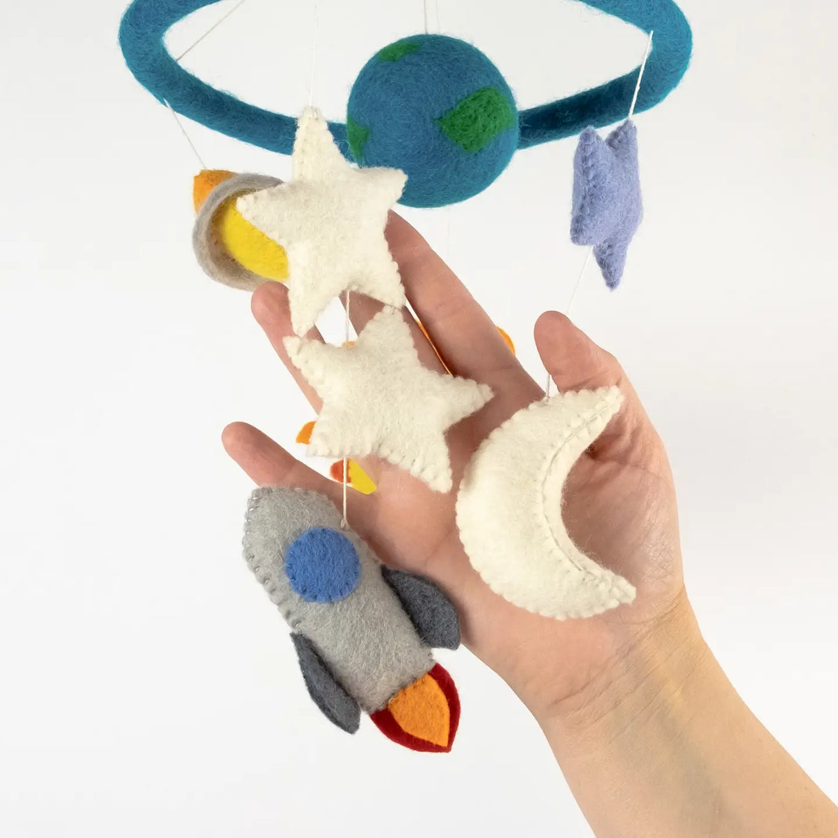Felt Mobile | Planets & Space with handmade felt rocket, stars, moon, and planets hanging from a blue hoop.