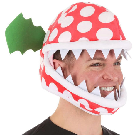 Man wearing Piranha Plant Jawesome Hat with white polka dots, felt teeth, and green felt leaves on white background.