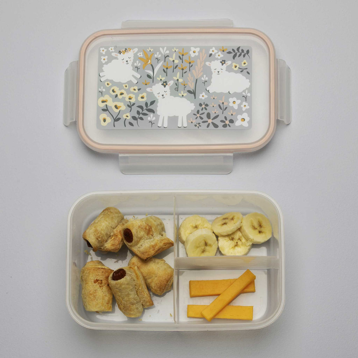 Good Lunch Bento Box | Lily the Lamb with three compartments holding snacks and a colorful lamb floral lid design.