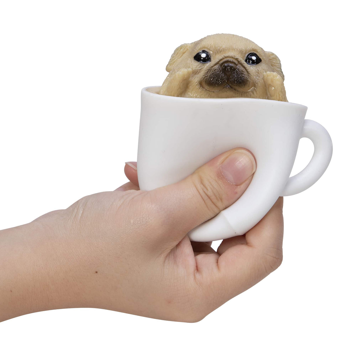 Hand squeezing a white cup with a squishy puppy toy inside from the Pup in a Cup! collection.
