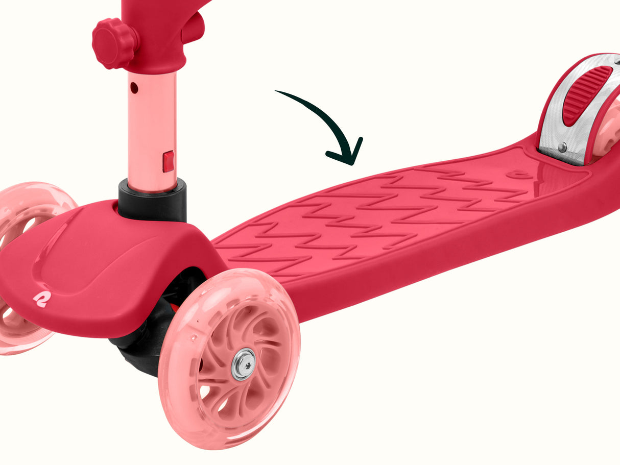 Chipmunk Plus Kids' Kick Scooter | Bubblegum close-up of pink deck and front light-up wheels on a kids' scooter.