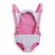 Pink and floral baby doll sling with adjustable straps and plastic closures for 14 to 17 inch dolls