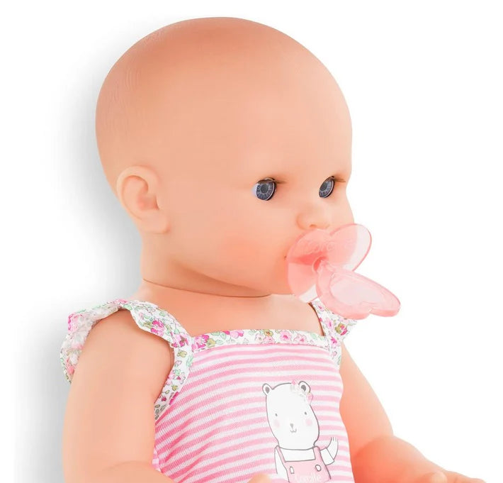Drink & Wet Emma doll with pacifier, soft vinyl body, wearing pink striped outfit, designed for toddler play and potty training.