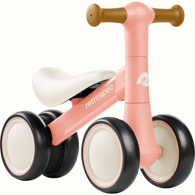 Cricket 2 Baby Walker Balance Bike in baby pink with no-scratch wheels, designed to help toddlers learn balance and riding skills.