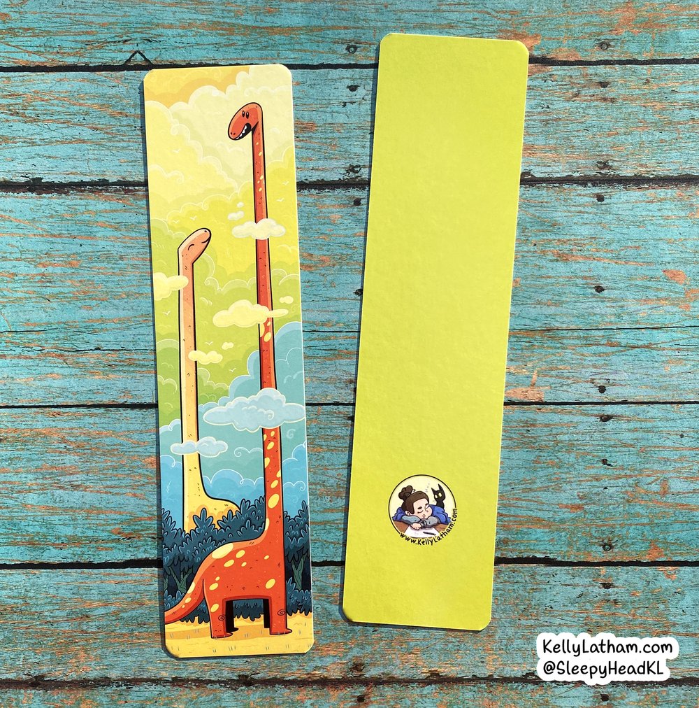 Dinosaur Clouds Bookmark showing colorful dinosaurs with heads in clouds on high gloss coated paper.