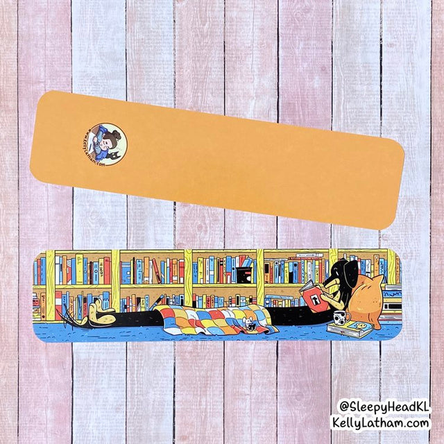 Reading Dog Bookmark showing a cozy dog under a blanket with books on a colorful shelf design.