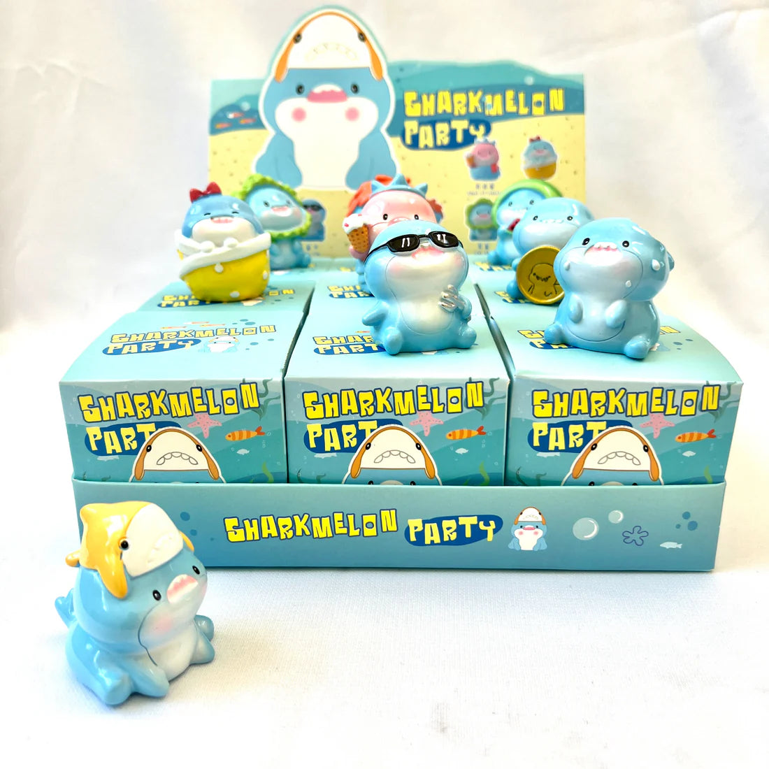 Shark Figurine Blind Box featuring cute assorted resin sharks in colorful packaging from Sharkmelon Party collection.