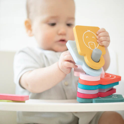 Baby playing with colorful foam animal flashcards on stand stacking with Animal Stacker Tub Hub toy