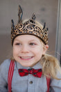 Medieval Crown | Gold/Black worn by smiling child, detailed gold and black design, flexible comfort with Velcro sizing.