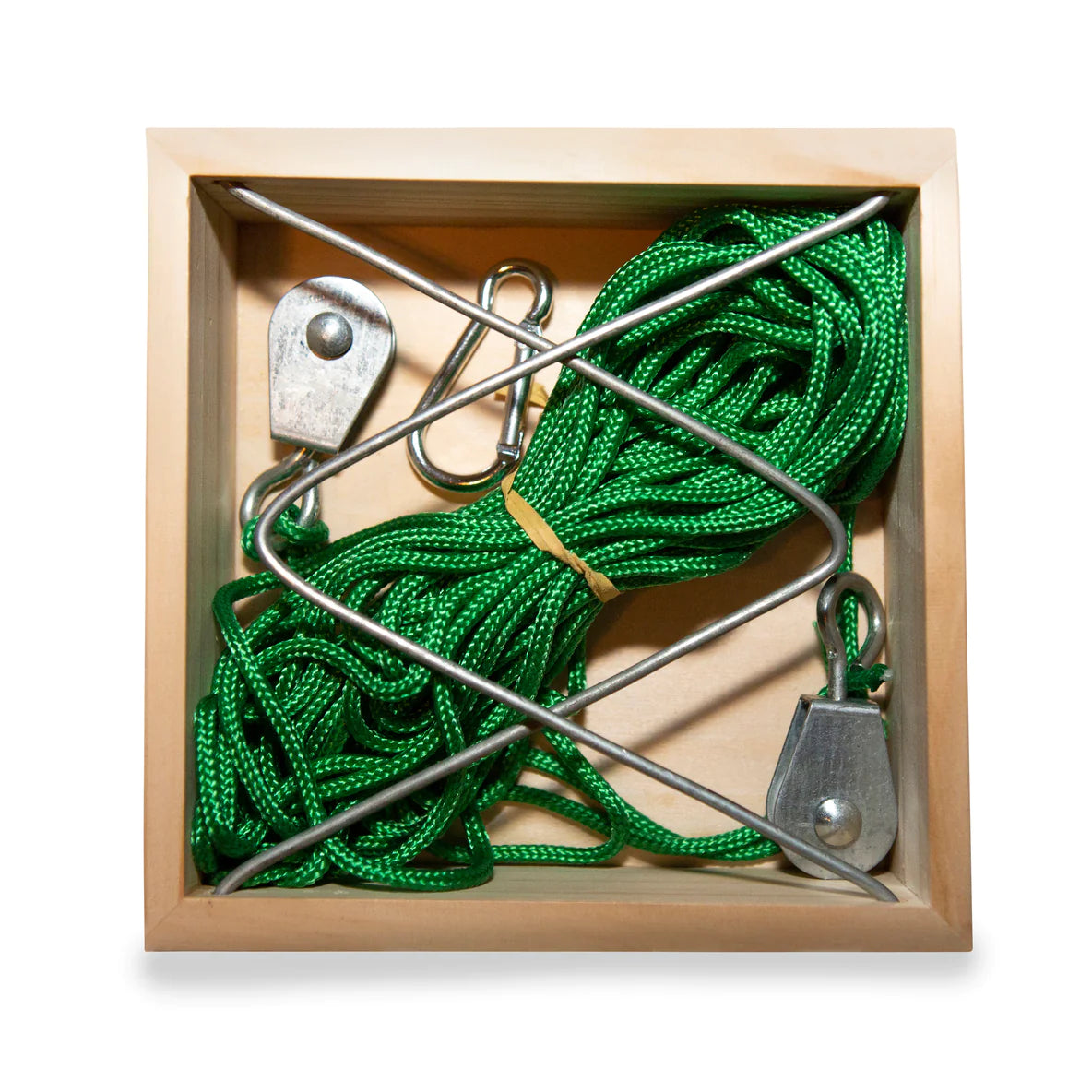 Huckleberry Cable Transport with green cable and metal pulleys in a wooden box for long-distance message transmission.