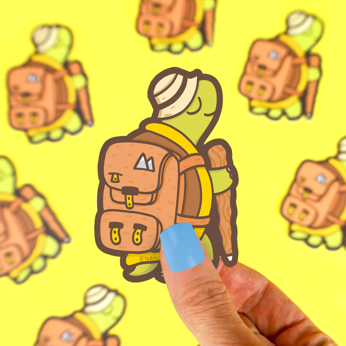 Hiking Tortoise Sticker vinyl sticker showing a slow hiking tortoise with backpack and walking stick on yellow background
