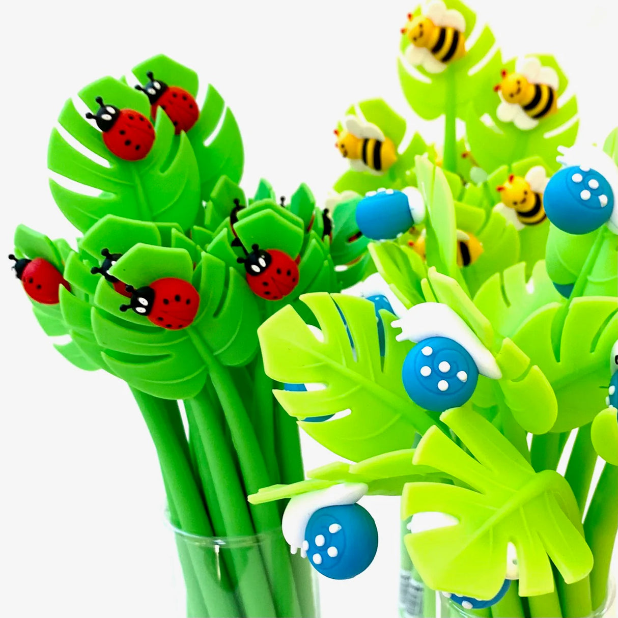 Insect Wiggle Gel Pen with fine tip featuring colorful ladybug, bee, and mushroom designs on green leaf-shaped tops.