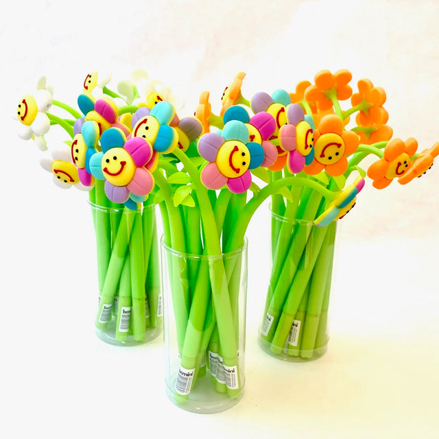 Smile Flower Wiggle Gel Pen with colorful smiling flower tops and green stems in clear containers, assorted styles sold separately.